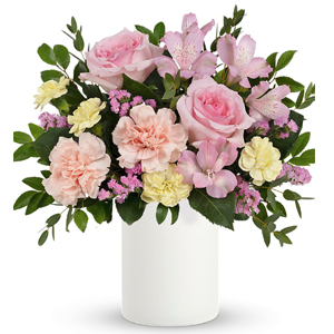 Fresh as a spring breeze, this whimsical, blush-hued arrangement presented in a simple white pot, is the perfect Mother's Day gi