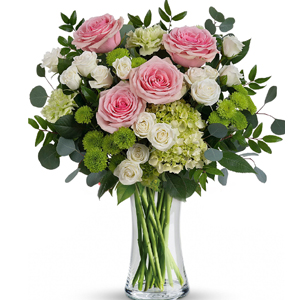 Nothing looks quite as fresh as soft pink roses among bright green and white blooms! Pamper mum with this decadent design in an