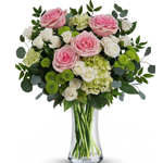 Nothing looks quite as fresh as soft pink roses among bright green and white blooms! Pamper mum with this decadent design in an