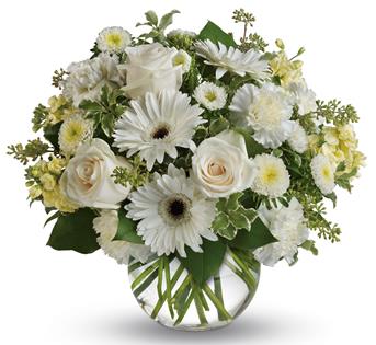 Wondrous white roses, gerberas and carnations in a vase bring a breath of fresh air to your special someone.