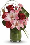 This gorgeous arrangement delivers the spirit of adventure. Its a unique mix of red roses, pink lilies, leaves and lily grass a