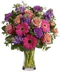 Give the gift of pure bliss! Lush, lavish and luxurious, this beautiful bouquet of roses, gerberas, stock and carnations in a va