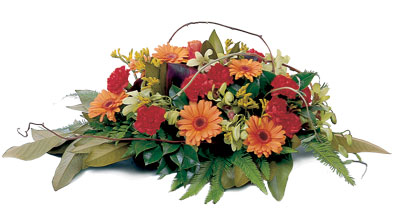 A warm and loving Table Arrangement of stunning seasonal flowers, the centre piece for any occasion