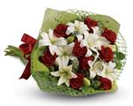 - Add some romance with this rich bouquet of luxurious red roses and white lilies.