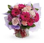 - Treat them to a special surprise! Hot pink gerbera mix with pale pink roses and carnations in this delightfully delicious bouq