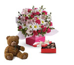 Box arrangement of pink spray roses,  hot pink carnations, white daisy spray chrysanthemums,  white/ pink alstroemeria, with a t
