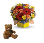 You will want to put this colourful arrangement with teddy.