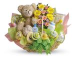 - Lucky bear! Make the new parents smile with this charming basket filled with flowers, assorted baby care essentials and a gorg