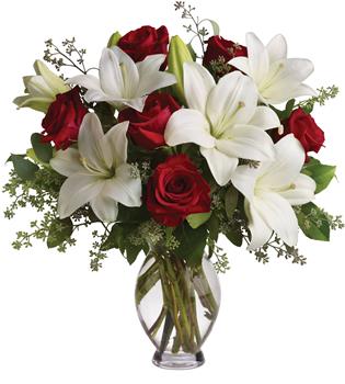 - Put these words into flowers with this magnificent arrangement of red roses and white lilies accented with fresh greenery deli