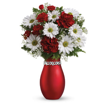 A special show of kindness, on any day of the year! This eye-catching red and white XOXO keepsake vase arrangement will surprise
