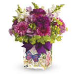 Lift a good friends spirits with a lovely lavender and green arrangement, and send cheerful wishes their way! Presented in a En