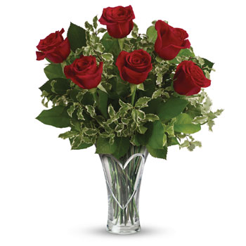 Romance 101! Classic red roses, fresh greens and a fabulous Heartfelt keepsake vase are the surest way to capture even more of h