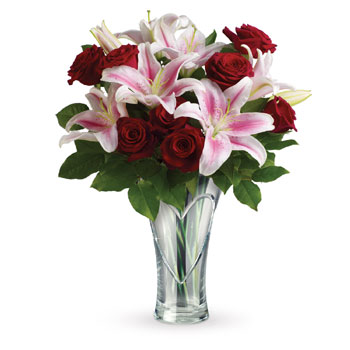 Does she melt your heart? Let her know with roses and lilies in a dazzling Heartfelt keepsake vase. Shell get the message