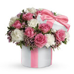Brighten someones day with an exquisite array of pink and white flowers in a Hats Off keepsake vase. A lovely,lasting gift for
