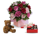 Sing her a love song - with roses chocolates and a teddy