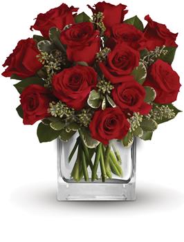 Turn up the heat on a new romance or a lifelong love affair with this classic cube arrangement of one dozen red roses.