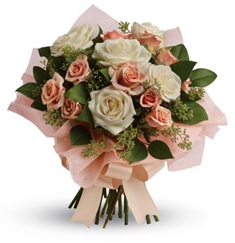 A fresh, feminine spin on the classic rose bouquet, this creamy mix of peach and cream roses is the ultimate in romance