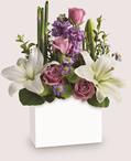 - An elegant way to show you care, this bit of bliss blends luxurious lavender roses with wondrous white lilies into a stunning
