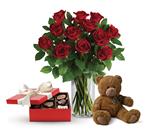 - This lavish gift set includes a gorgeous vase arrangement of twelve long stem red roses, accented with greenery, plus chocolat