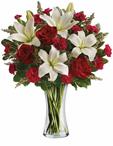 - Timeless romantic red roses and fragrant white lilies in a classic glass vase - a sweet yet spectacular way to express whats