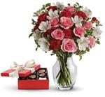 - This charming gift set includes a delicious box of chocolates paired with a vase arrangement of light pink spray roses, red mi