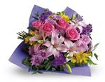 Contemporary yet classic, this bouquet includes an elegant mix of roses, lilies and alstroemeria.
