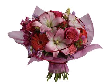 This stylish array of roses, lilies and gerberas makes yours a sophisticated statement of affection.