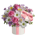 Make her day with this charming arrangement in a charming ceramic hat box.She'll adore it
