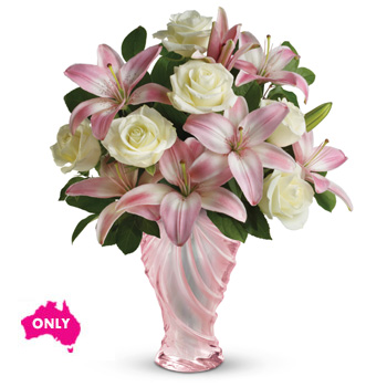 A spectacular choice of flowers arranged in our Love glass vase