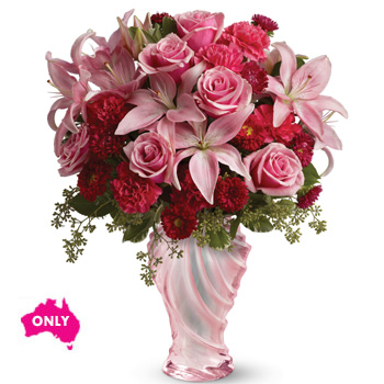 This amazing mix will warm her heart , arranged in our Love glass vase