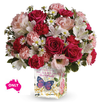 This delightful arrangement comes in an Enchanted glass cube