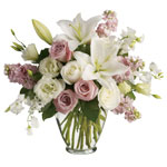 Natural vase arrangement of roses, lilies, and lissies