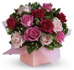 Sing her a love song - with roses. This lush red and pink rose arrangement tells her just how much you care.