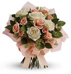 A fresh, feminine spin on the classic rose bouquet, this creamy mix of peach and cream roses is the ultimate in romance.
